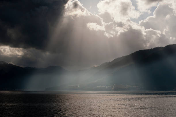 istock Beautiful cloudy sky with sunbeams 1192472555