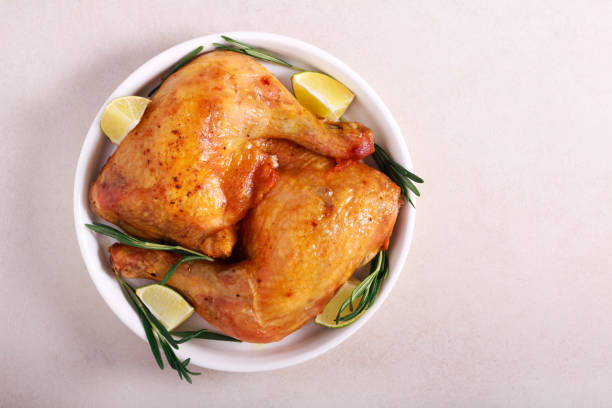 istock Chicken legs roasted with lime and rosemary 1192473713
