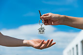 Handing over the house keys from one person to another