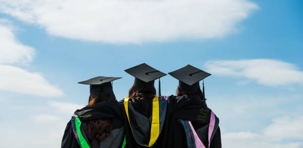 istock Rear view of three graduate students looking at sky 1192474190