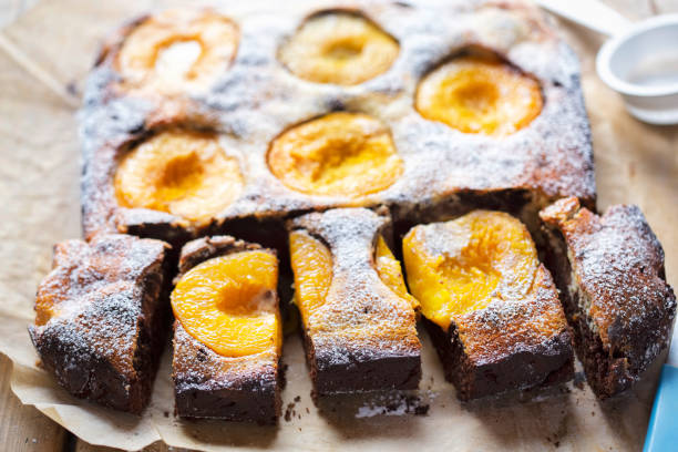 istock Brownie cheesecake with apricots icing sugar 1192474259