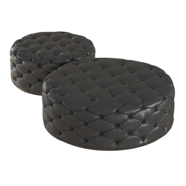 istock Two round quilted black leather poufs on an isolated background. 3d rendering 1192475366