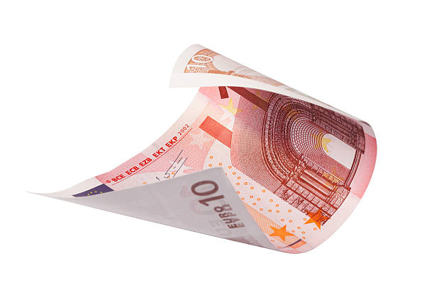 Rolled ten euro bank note on white background stock photo