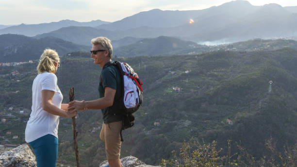 istock Mature hiking couple relax on mountain ridge 1192480005
