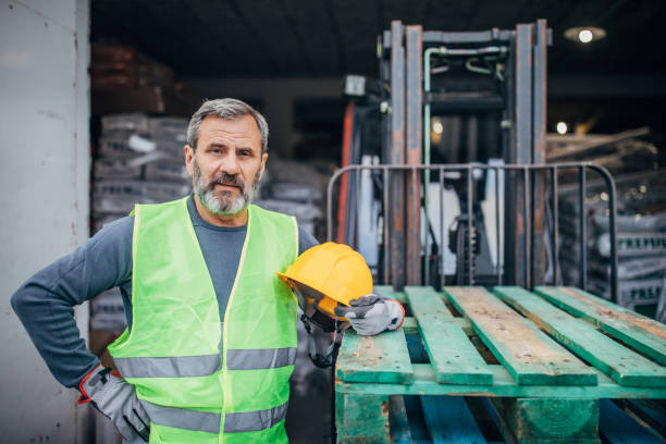 istock Portrait of warehouse owner in work suit 1192480021