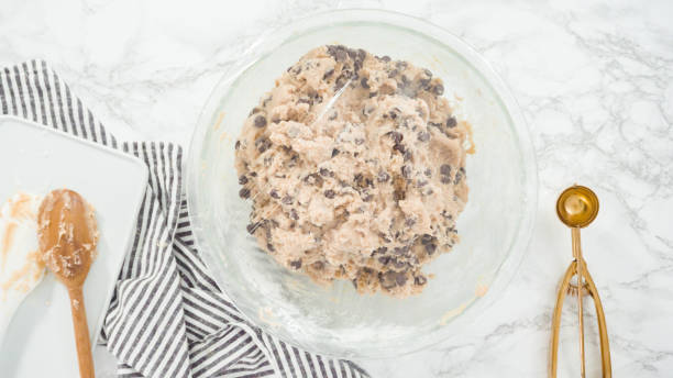 istock Mixing ingredients in a glass bowl to make chocolate 1192481740