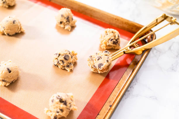 istock Homemade chocolate chip cookies dough scoops on a baking sheet 1192482451