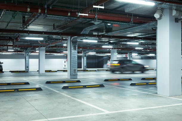 istock Horizontal image of motion blurred car on underground parking lot 1192482585