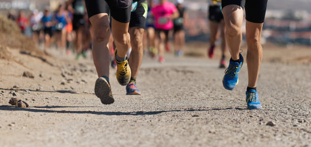istock Runners running shoes on trail run 1192483100