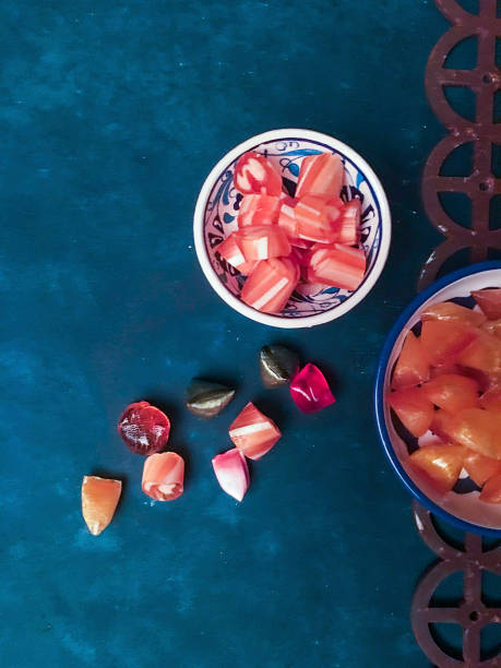 Strawberries, dumplings, jelly and beans on a pink background