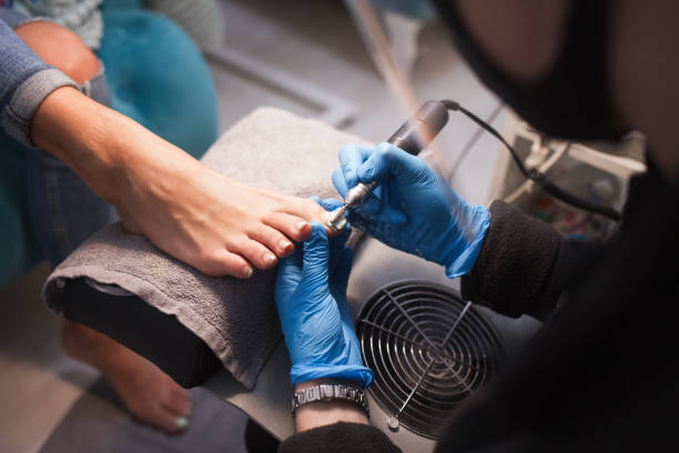 istock Pedicure master polishes nails before applying varnish 1192487204