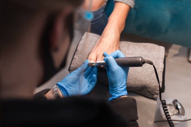 istock Pedicurist trim nails with manicure clippers 1192487235
