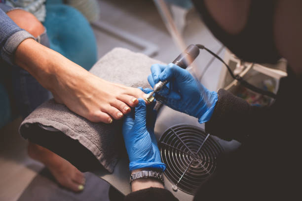 istock Pedicure master polishes nails before applying varnish 1192487255