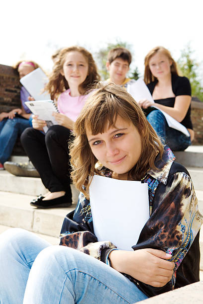 istock Smiling teens on stairs 119248835
