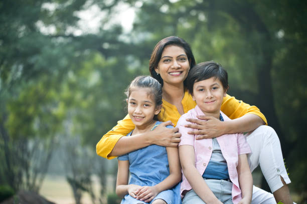 Happy mother with children at park