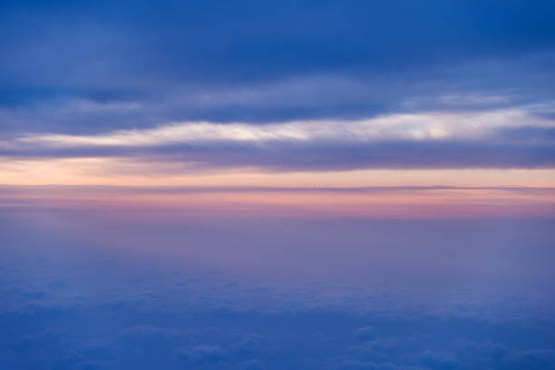 istock Sunset above the clouds, view from airplane window 1192492206