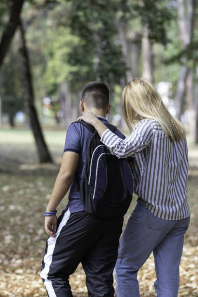 istock Young Boy is Going to the School with his Mother 1192493276