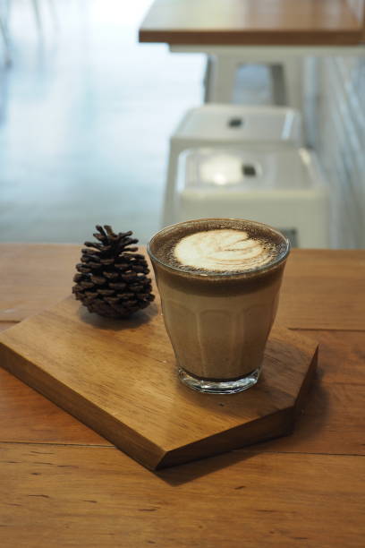 istock Hot coffee on wood plate in cafe. 1192495507