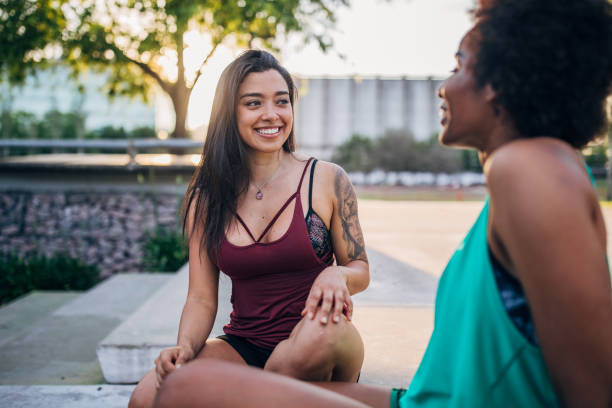 istock Beautiful young women resting after running 1192496149