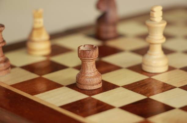 istock game of chess. chess Board and figures close up 1192497437