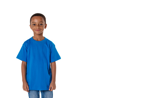 childhood and people concept- little african american boy wearing blue t-shirt and denim clothers , isolated with copyspace