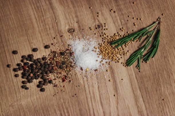 istock Fragrant spices are scattered on a white oak kitchen board. 1192500580