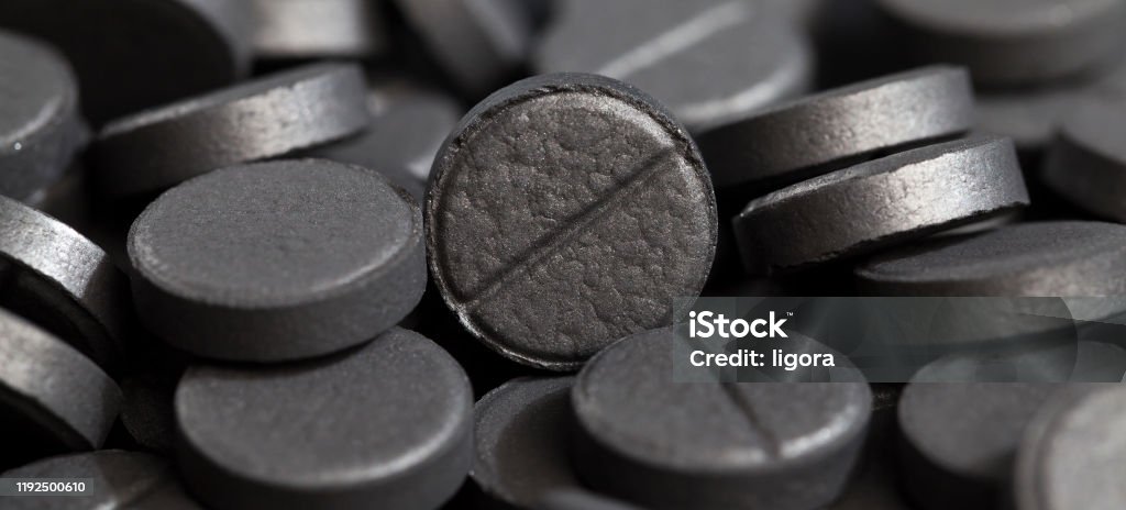 activated carbon activated carbon in pill form, used in medicine to treat diseases, close-up of medicines Antibiotic Stock Photo