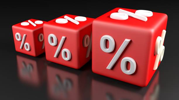istock Three red growing cubes, with percent sign, on a black glossy surface - 3D rendering illustration 1192507539