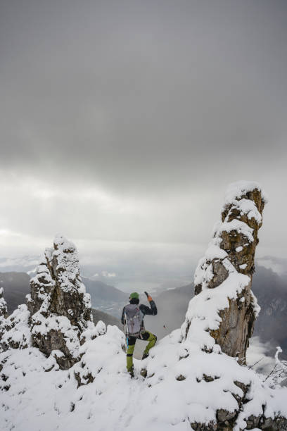 istock Alpinist On Snowy Peak Mountain 1192508785