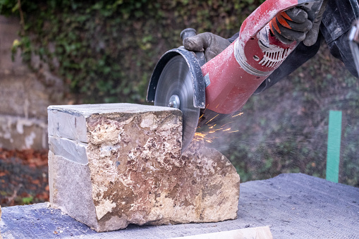 Stone Rope Cutting A Stonemason Using A Rotating Blade To Cut Through Stone Stock Photo ...