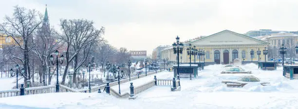 Photo of Moscow in winter, Russia. Snowy Alexander Garden and Manezhnaya Square near Moscow Kremlin.