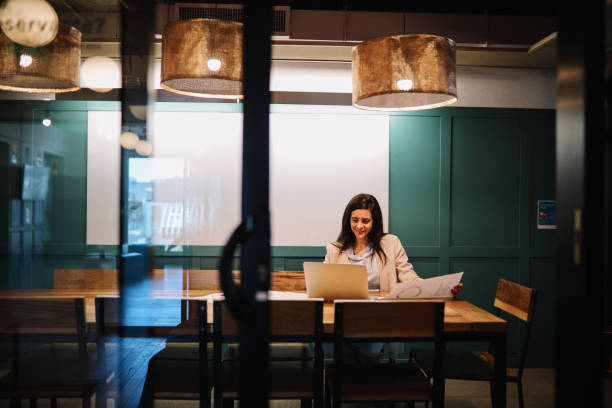 istock Businesswoman in her office working late 1192513182