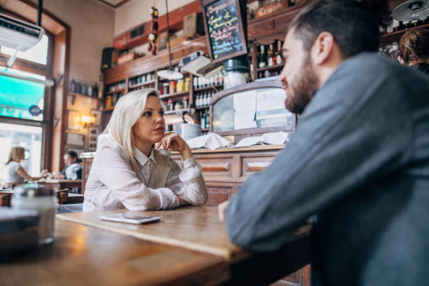 istock Couple sitting in coffee shop 1192513193