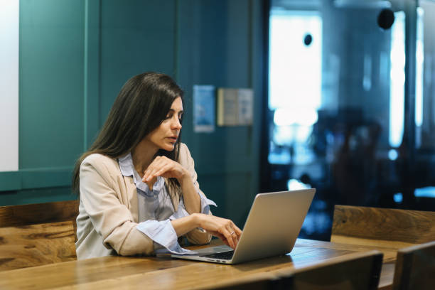 istock Businesswoman in her office working late 1192513214