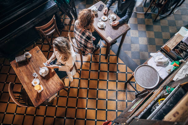 istock People sitting in coffee shop 1192514295