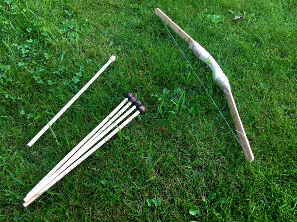 istock game wooden bow and arrow on green grass 1192514436