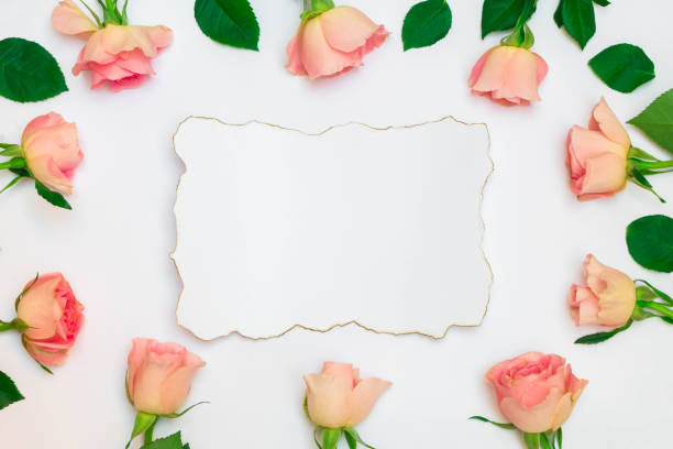 istock Floral frame composition with pastel roses and white paper vintage card 1192514528