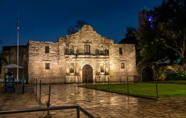Photo of View of the Alamo Mission in San Antonio at Night with Canon on the Side
