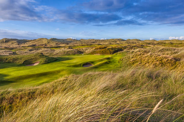 Traditional Links Golf Course Stunning image of Green on a traditional links golf course. Golf was first played in Scotland on courses built on links land which is the land between the sea and the fertile arable land. republic of ireland photos stock pictures, royalty-free photos & images