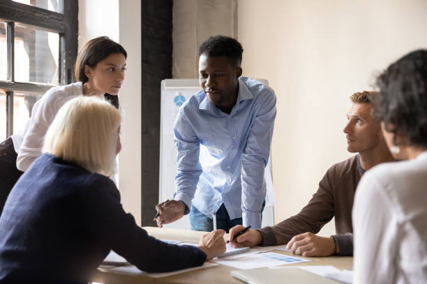 istock Focused diverse coworkers developing marketing strategy at office. 1192516620