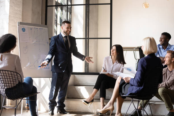 istock Positive male coach joking during educational workshop with colleagues. 1192516649