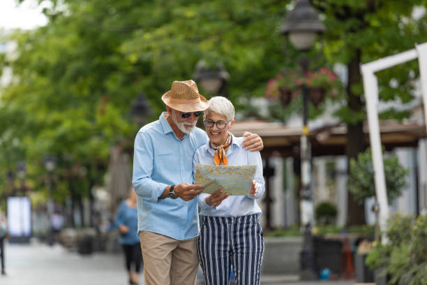istock Senior Couple with Tourist Map is Exploring the City 1192516708