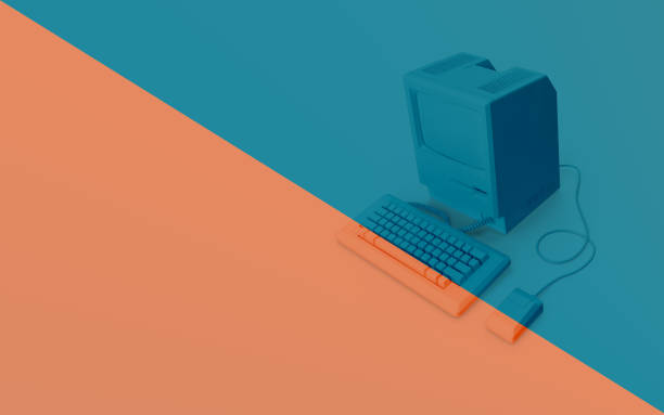 istock Old Computer Against Trendy Coral and Blue Color Background 1192517948