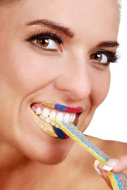 istock woman with colorful ribbon candy 119251810