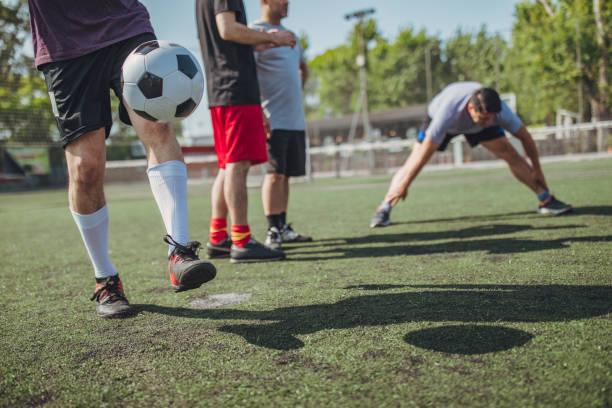 istock Male soccer players exercising 1192518106