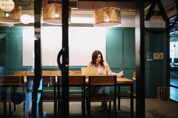istock Businesswoman in her office working late 1192519576