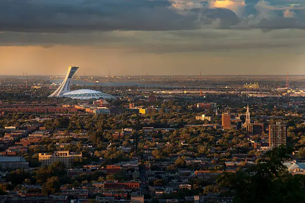 Color picture of the Olympic Stadium, viewed from the Mont-Royal, Montreal. Large shot. Photographed at the magic hour.
