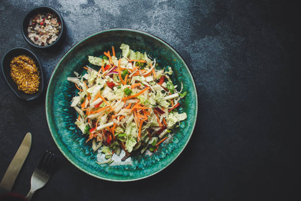 istock healthy vegetable salad (Chinese cabbage, carrot, onion, lettuce, mix salad, pumpkin) menu concept. food background. top view. copy space 1192521028