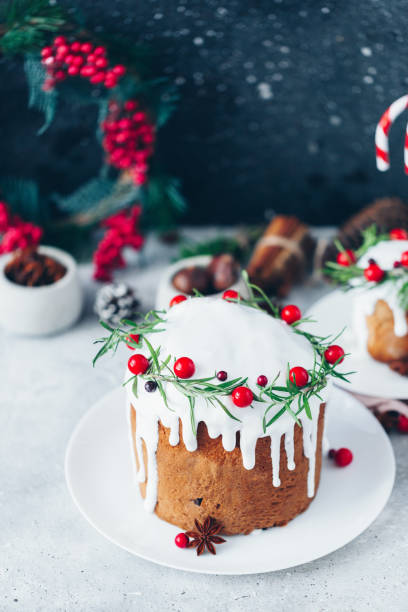 istock Traditional Christmas cake with cranberry and decorations on table 1192521236