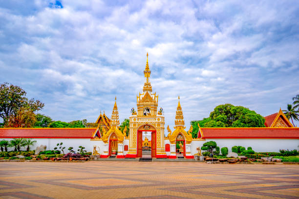istock Wat Prathatphanom temple on blue sky and white cloud background, famous temple for buddist people and tourist 1192522979